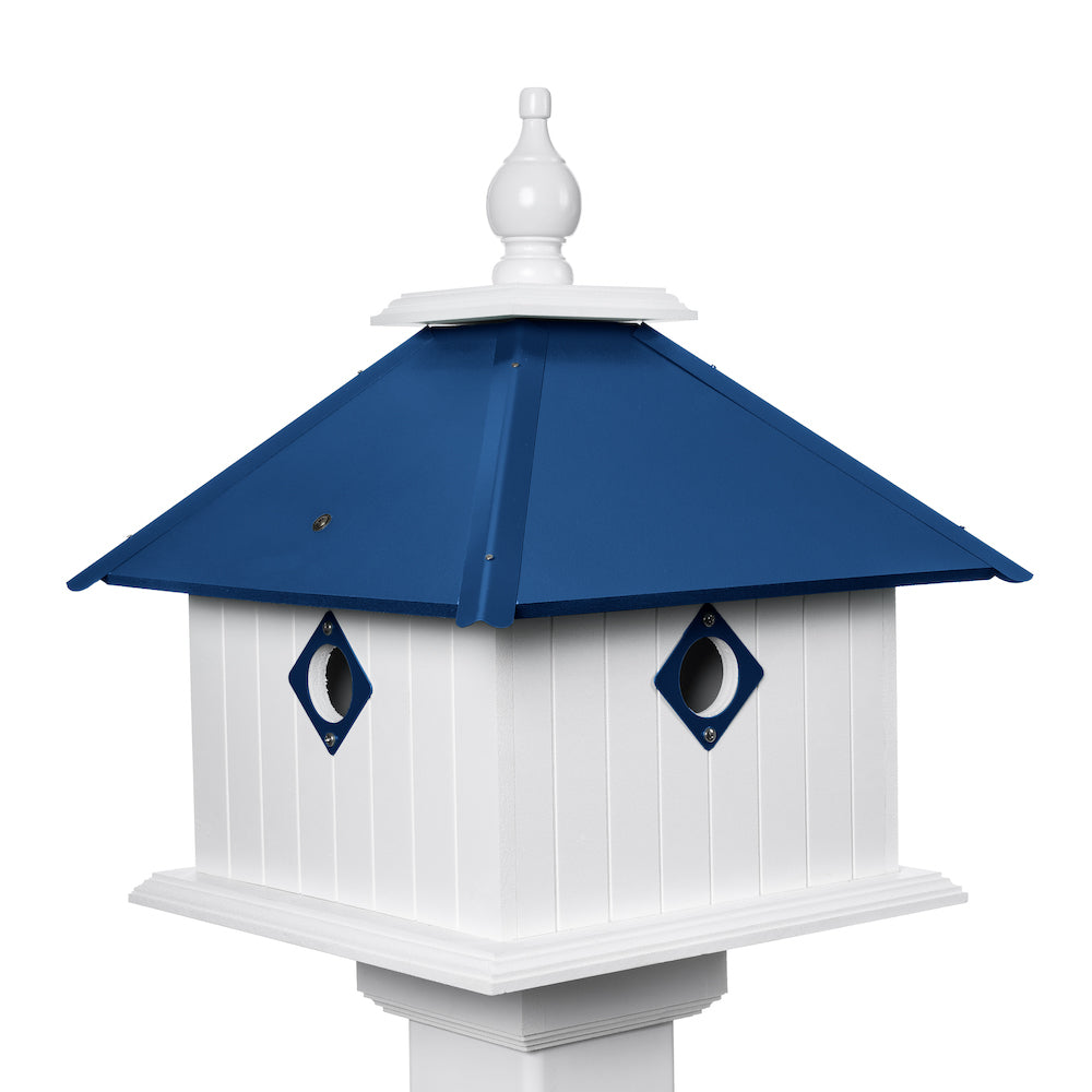 Cobalt blue carriage birdhouse with white background