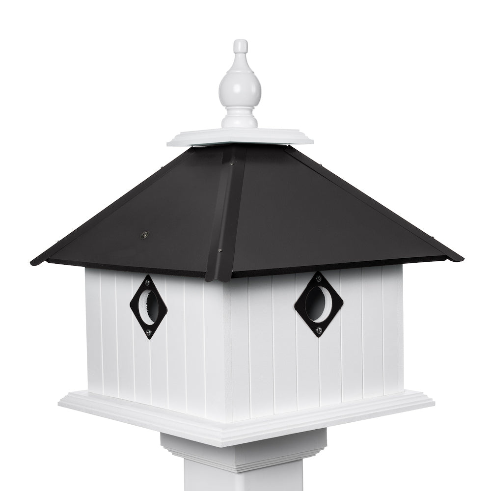 Black carriage birdhouse with white background